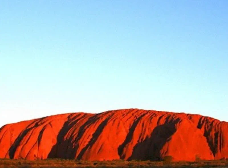 The Majestic Sights of Uluru at Sunrise and Sunset